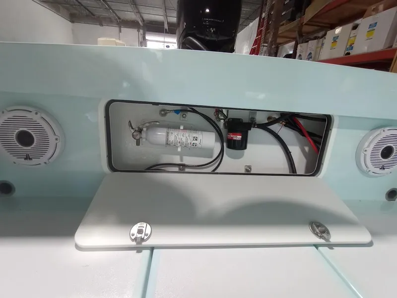 Slide: The Image of 2025 Cuda Craft 19 boat interior with fire extinguisher and wiring. - 13