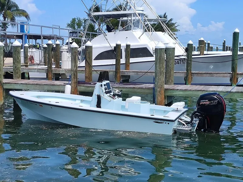 Slide: The Image of 2025 Cuda Craft 19 boat docked in marina, clear blue water, sunny day. - 3