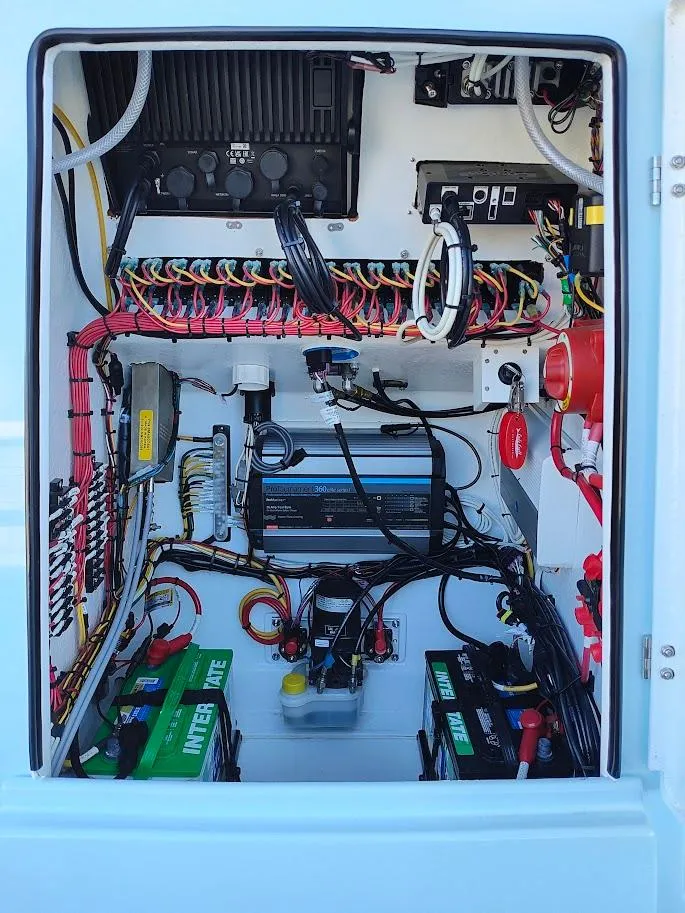 Slide: The Image of 2025 Cuda Craft 19 electrical panel with wiring and battery setup. - 7