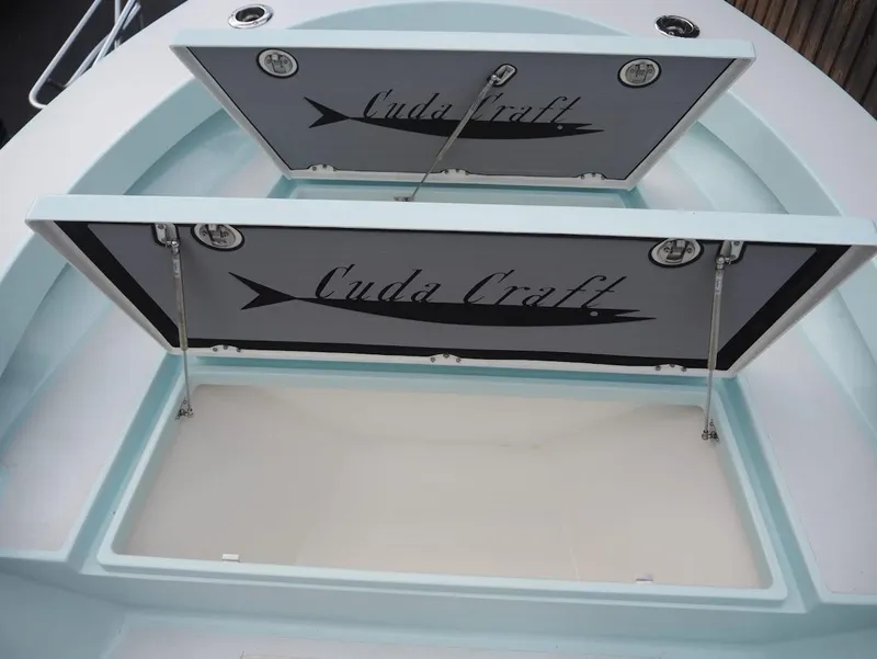Slide: The Image of Open storage compartment on 2025 Cuda Craft 19 boat. - 8