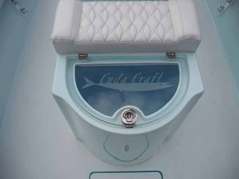 Slide: The Image of Cuda Craft 19 boat seat with storage, 2025 model, featuring diamond-patterned upholstery. - 9