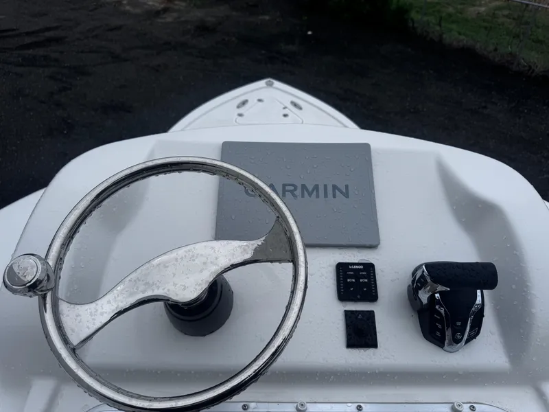 Slide: The Image of Steering console of 2025 Pair Customs 24DV boat with Garmin navigation system. - 18