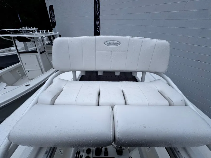 Slide: The Image of White seating on 2025 Pair Customs 24DV boat, featuring sleek design and comfortable cushions. - 19