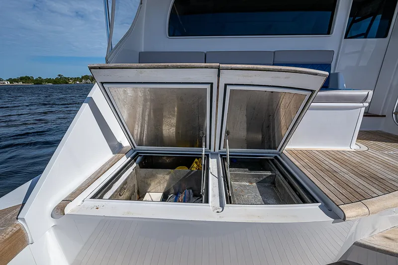 Slide: The Image of 2017 F&S Custom Express Sportfish with open deck storage compartments. - 13