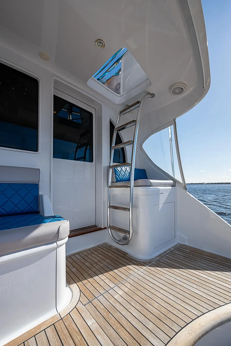 Slide: The Image of 2017 F&S Custom Express Sportfish yacht interior with ladder and seating. - 15