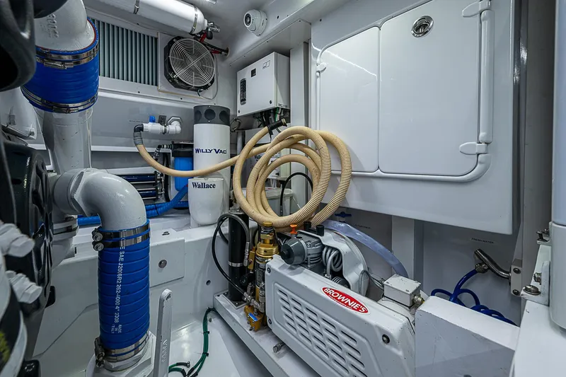 Slide: The Image of Engine room of 2017 F&S Custom Express Sportfish with advanced equipment and piping. - 23