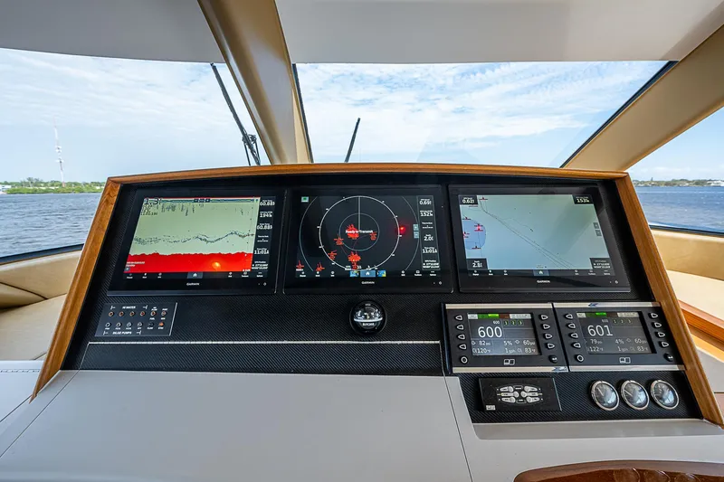 Slide: The Image of 2017 F&S Custom Express Sportfish dashboard with navigation and radar displays. - 31