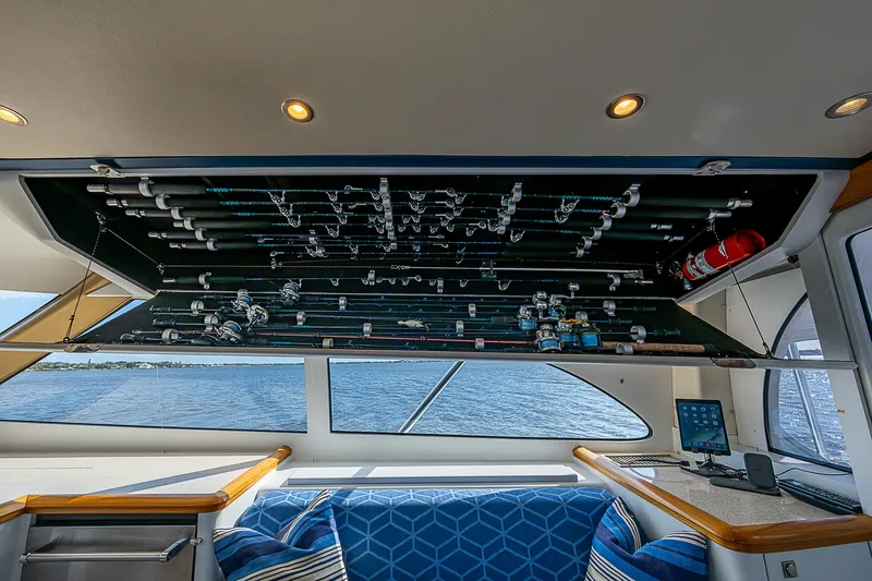 Slide: The Image of 2017 F&S Custom Express Sportfish interior with fishing rod storage and ocean view. - 33