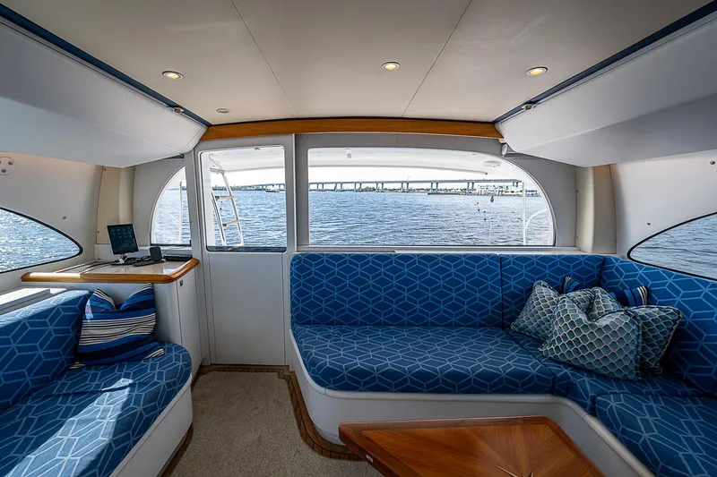 Slide: The Image of Interior of 2017 F&S Custom Express Sportfish with blue seating and ocean view. - 35