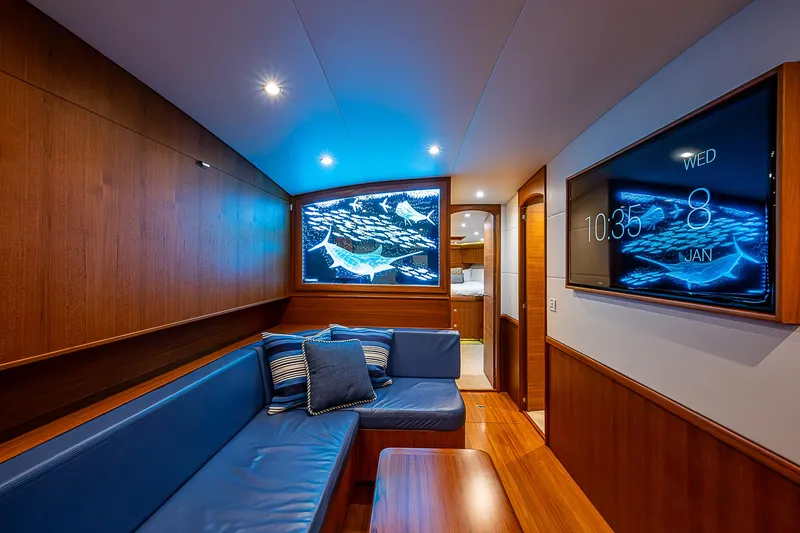 Slide: The Image of Luxurious 2017 F&S Custom Express Sportfish interior with blue seating and modern decor. - 43