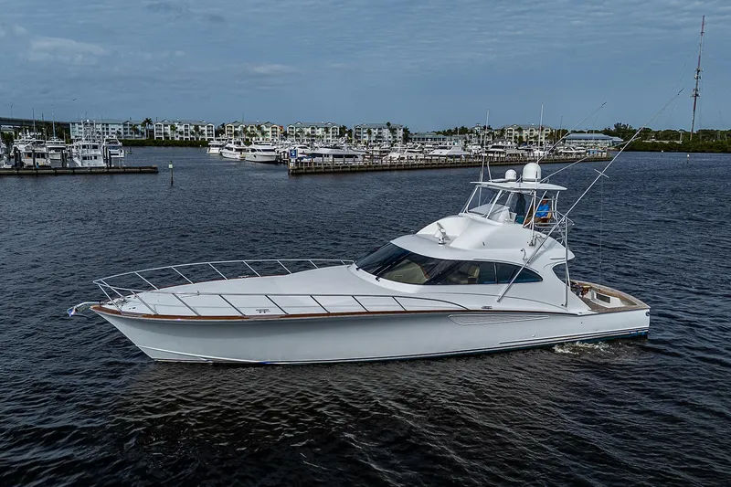 Slide: The Image of 2017 F&S Custom Express Sportfish yacht on calm waters near marina. - 74