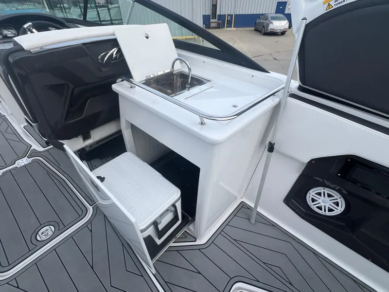 Slide: The Image of 2024 Monterey 255 Super Sport boat interior with sink and storage compartments. - 6