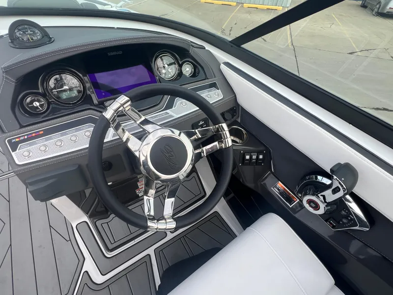 Slide: The Image of 2024 Monterey 255 Super Sport boat dashboard with modern steering wheel and controls. - 7
