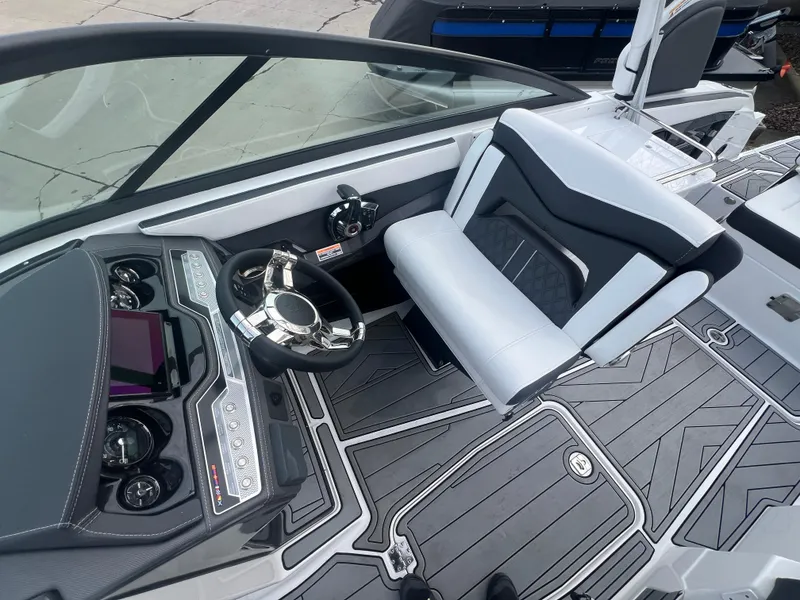 Slide: The Image of 2024 Monterey 255 Super Sport boat interior with sleek dashboard and modern seating. - 8