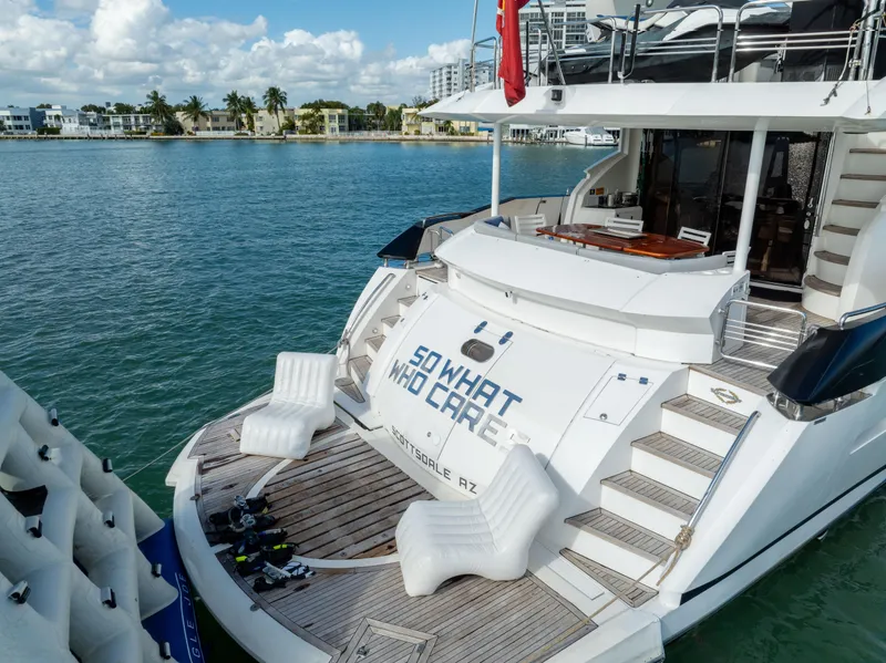 Slide: The Image of Luxury Sunseeker 150 GT yacht docked, featuring spacious deck and scenic waterfront view. - 17