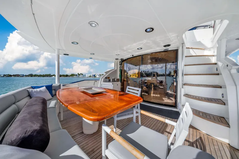 Slide: The Image of Luxurious Sunseeker 150 GT yacht deck with elegant seating and dining area, 2003 model. - 24