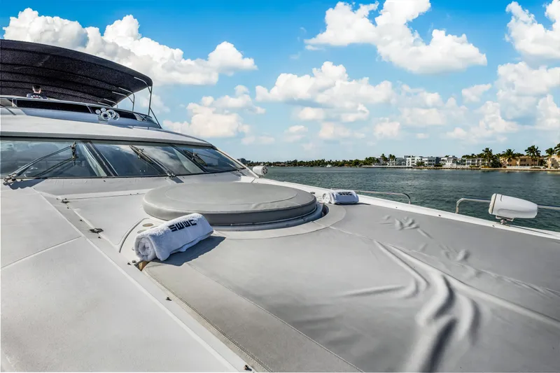 Slide: The Image of Sunseeker 150 GT yacht deck, 2003 model, cruising on a sunny day with blue skies. - 25