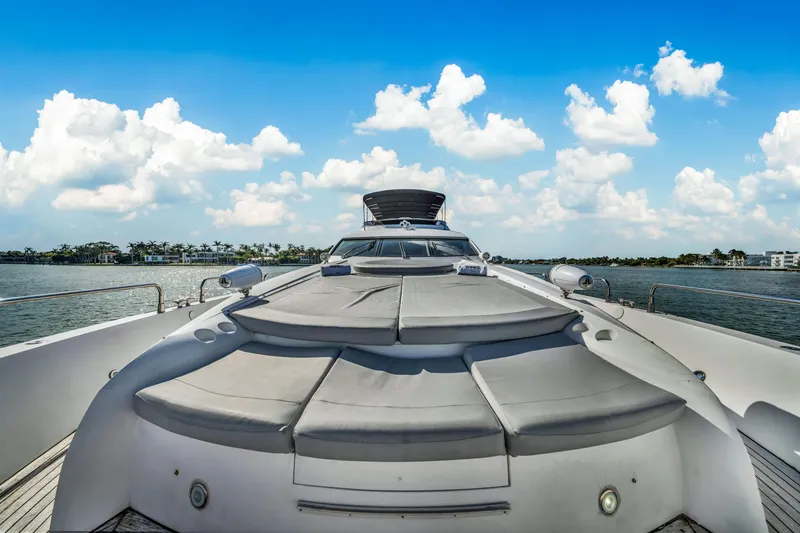Slide: The Image of Sunseeker 150 GT yacht deck, 2003 model, under a bright blue sky. - 26