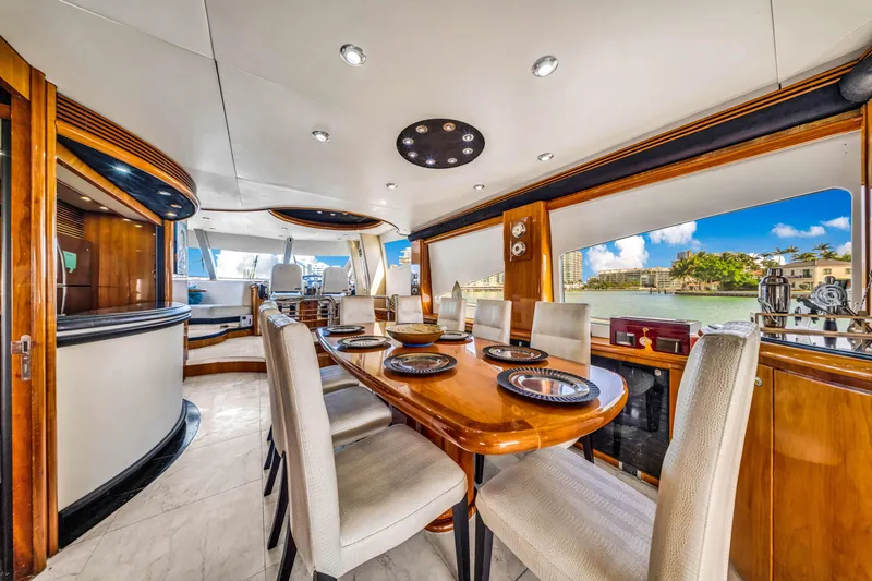 Slide: The Image of Luxurious interior of 2003 Sunseeker 150 GT yacht with elegant dining area. - 29