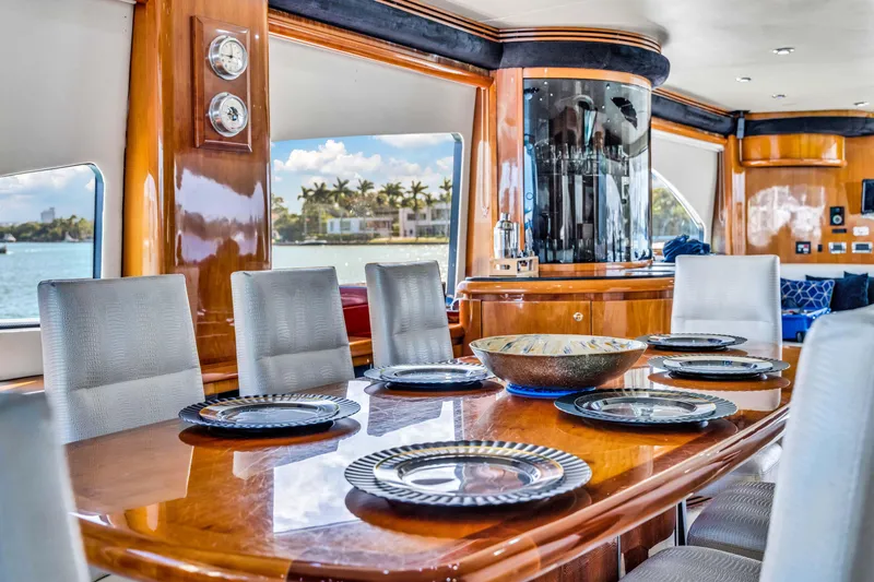 Slide: The Image of Luxurious dining area on a 2003 Sunseeker 150 GT yacht with elegant wood finishes. - 3