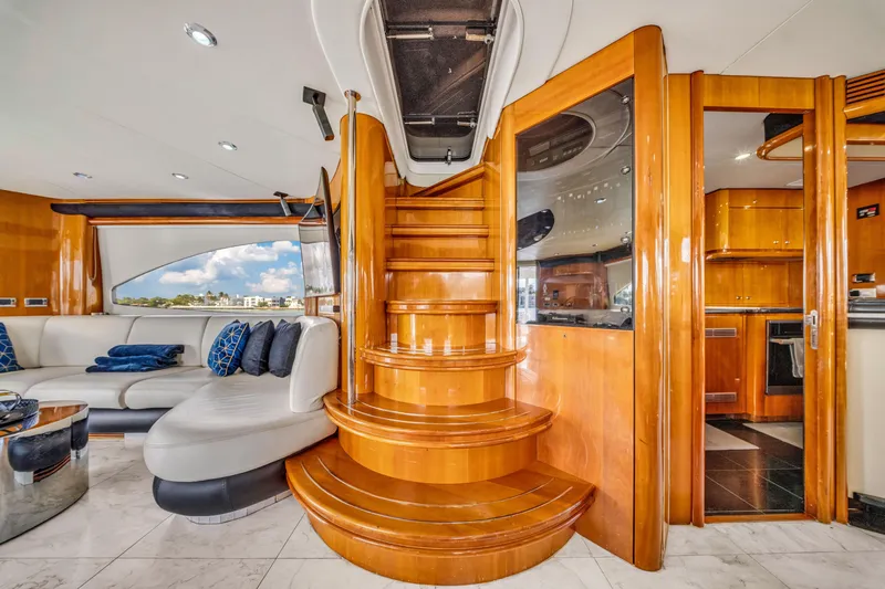 Slide: The Image of Luxurious interior of 2003 Sunseeker 150 GT yacht with elegant wooden staircase. - 31