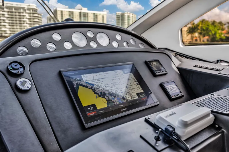 Slide: The Image of Dashboard of 2003 Sunseeker 150 GT yacht with navigation display and controls. - 41