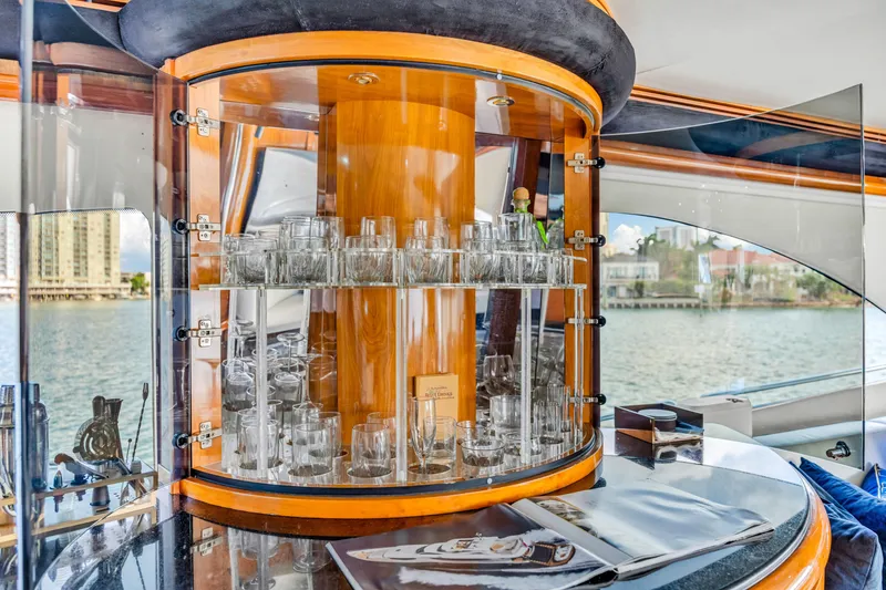 Slide: The Image of Luxurious Sunseeker 150 GT yacht interior with elegant glassware display, 2003 model. - 44