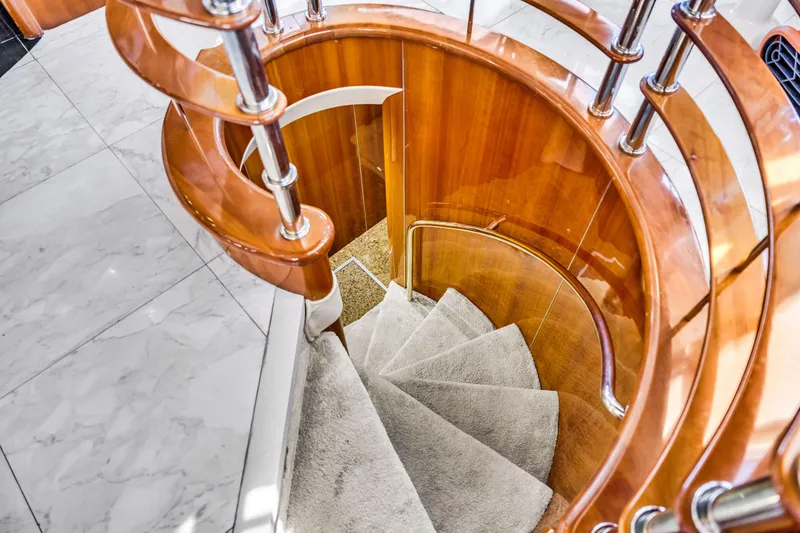 Slide: The Image of Curved wooden staircase on 2003 Sunseeker 150 GT yacht interior. - 45