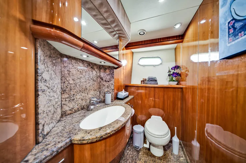 Slide: The Image of Luxurious bathroom in 2003 Sunseeker 150 GT yacht with wood paneling and granite surfaces. - 48