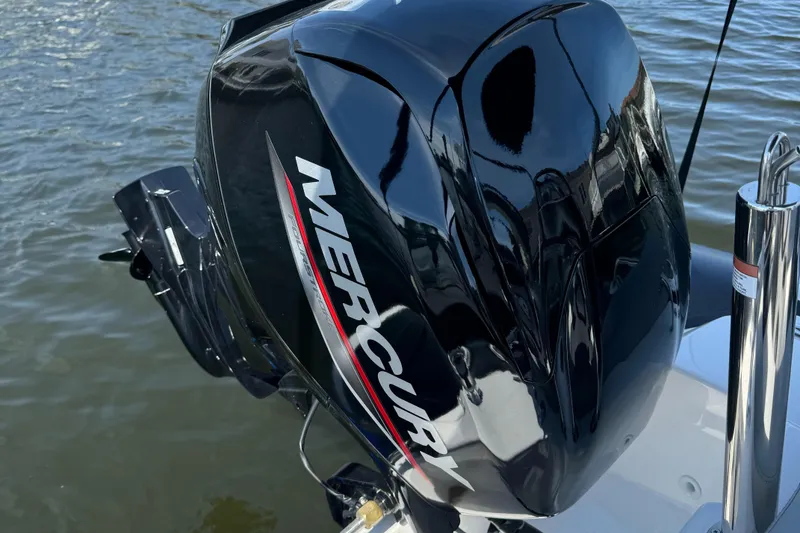 Slide: The Image of Mercury outboard motor on 2023 Grand Inflatables G380N boat, on water. - 6