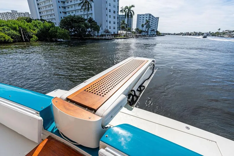 Slide: The Image of Ferretti Yachts 620, 2003 model, docked by waterfront with scenic view. - 10
