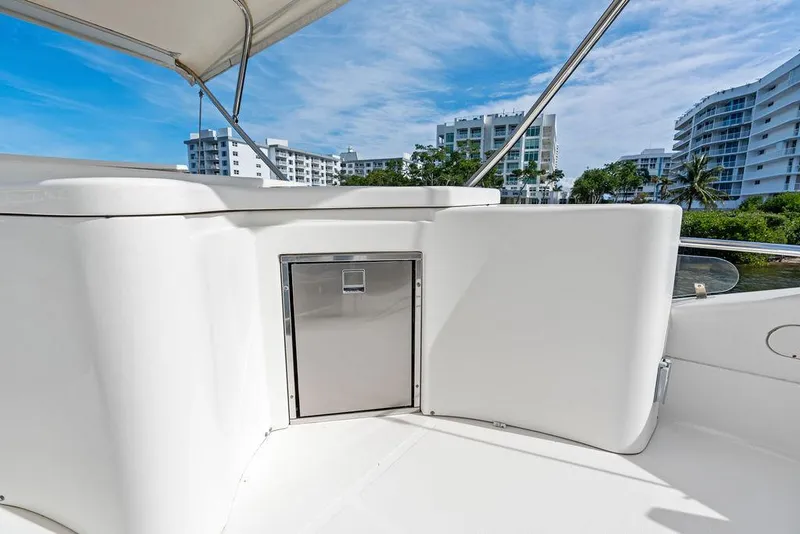 Slide: The Image of 2003 Ferretti Yachts 620 deck with modern design and cityscape background. - 16