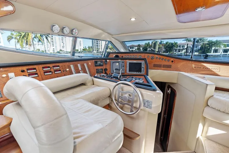 Slide: The Image of Luxurious 2003 Ferretti Yachts 620 helm with leather seating and advanced navigation controls. - 26
