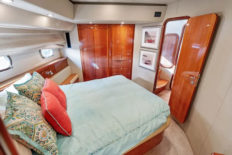 Slide: The Image of Luxurious bedroom interior of 2003 Ferretti Yachts 620 with elegant wood finishes. - 34