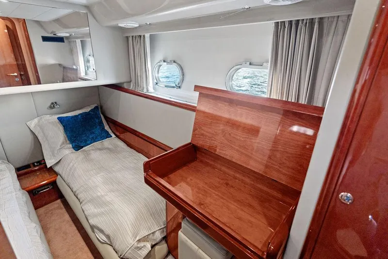 Slide: The Image of Luxurious cabin interior of 2003 Ferretti Yachts 620 with wood finish and ocean view. - 36