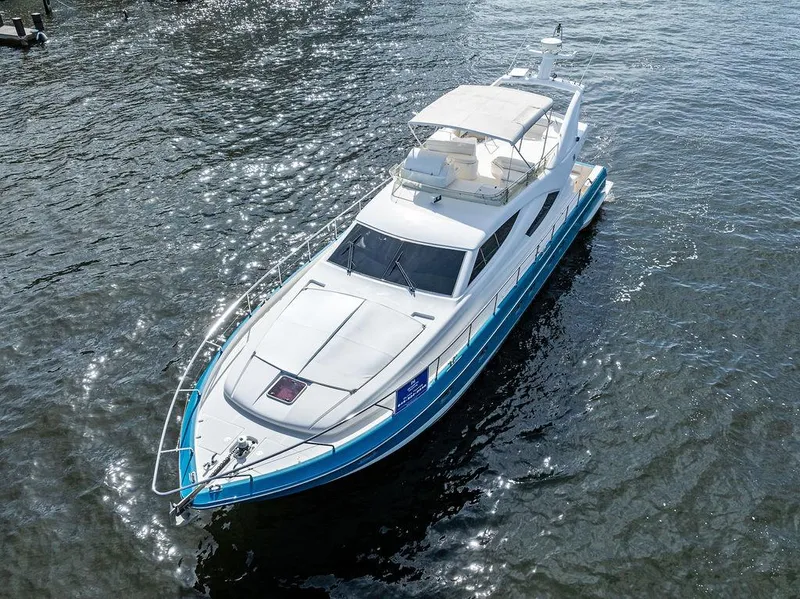 Slide: The Image of 2003 Ferretti Yachts 620 cruising on open water, aerial view. - 4