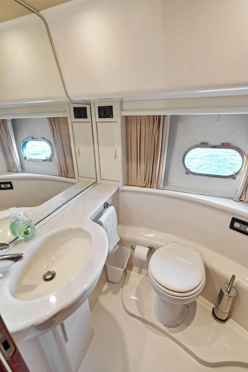Slide: The Image of Luxurious bathroom in 2003 Ferretti Yachts 620 with ocean view portholes. - 41