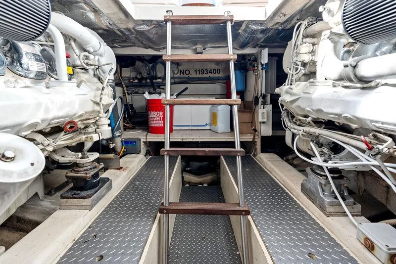 Slide: The Image of Engine room of 2003 Ferretti Yachts 620 with ladder and equipment. - 49