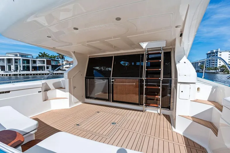 Slide: The Image of Spacious deck of 2003 Ferretti Yachts 620 with modern design and waterfront view. - 7