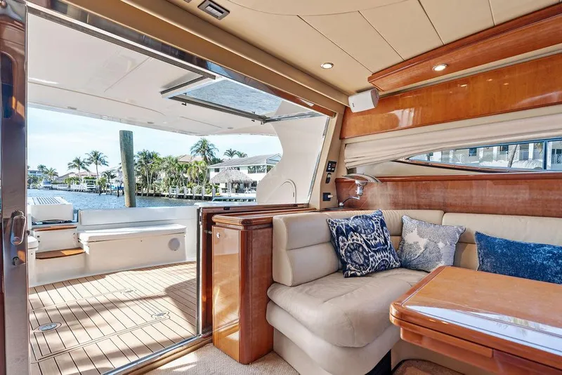 Slide: The Image of Luxurious interior of 2003 Ferretti Yachts 620 with elegant seating and waterfront view. - 21