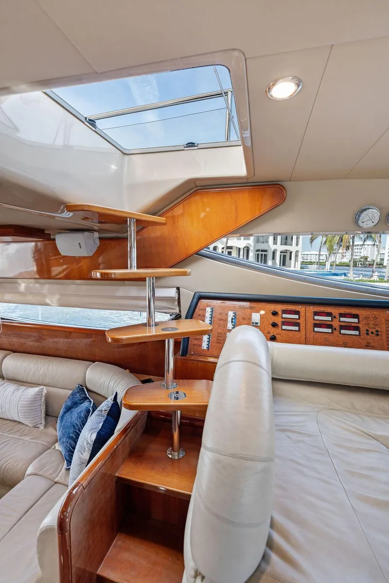 Slide: The Image of Interior of 2003 Ferretti Yachts 620, featuring elegant wood finishes and modern design. - 30