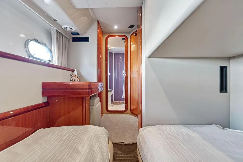Slide: The Image of Luxurious cabin interior of 2003 Ferretti Yachts 620 with twin beds and elegant wood finishes. - 37