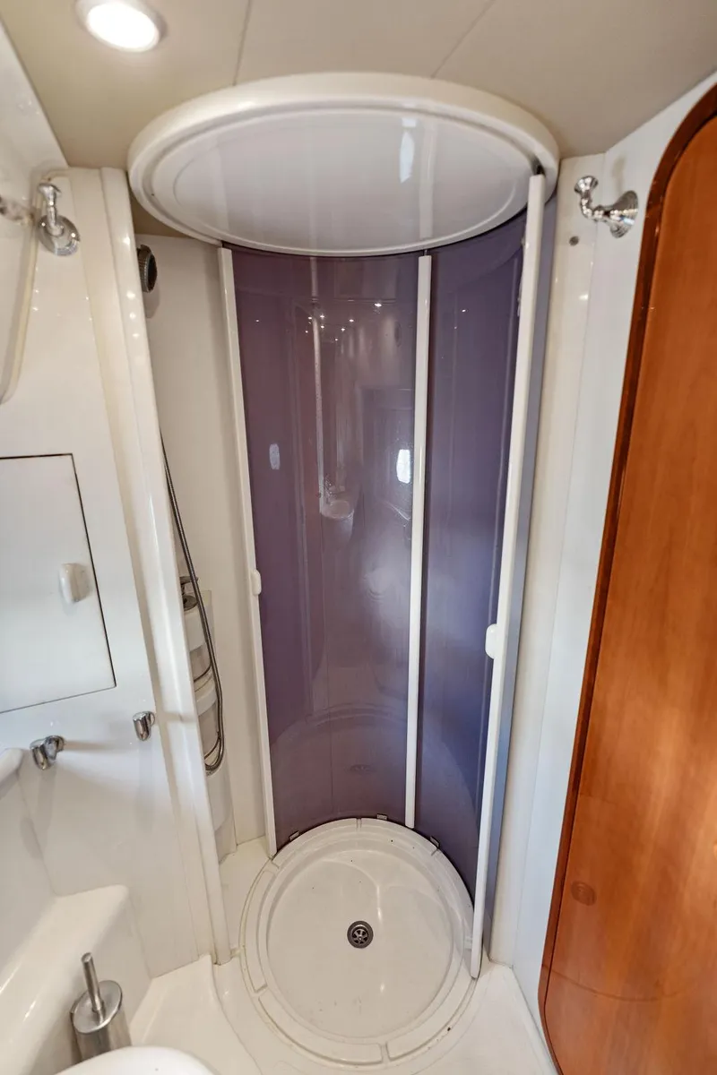 Slide: The Image of Compact shower area in 2003 Ferretti Yachts 620, featuring modern design and amenities. - 42