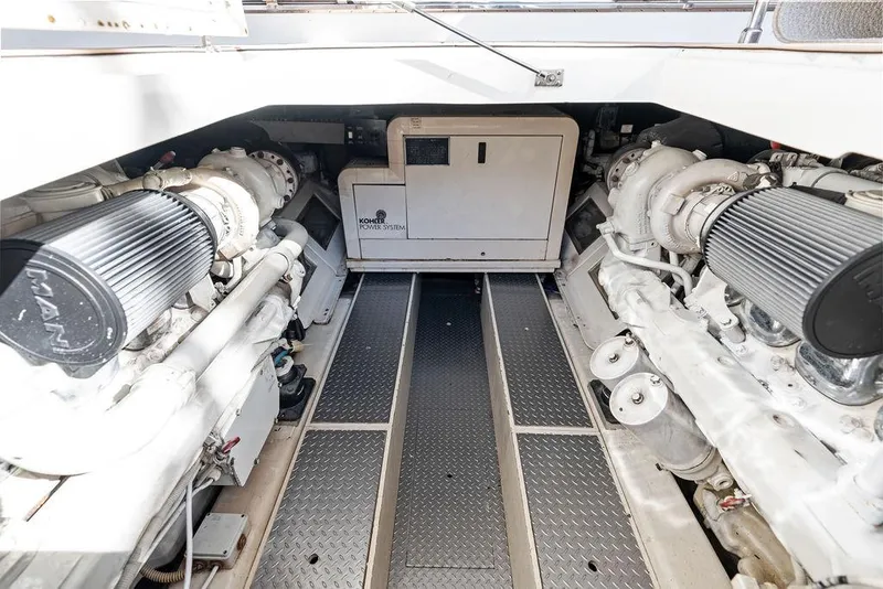 Slide: The Image of Engine room of 2003 Ferretti Yachts 620, showcasing dual engines and generator. - 46