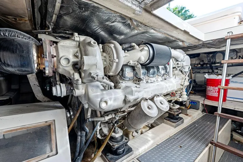 Slide: The Image of Engine room of 2003 Ferretti Yachts 620, showcasing powerful marine engine components. - 47