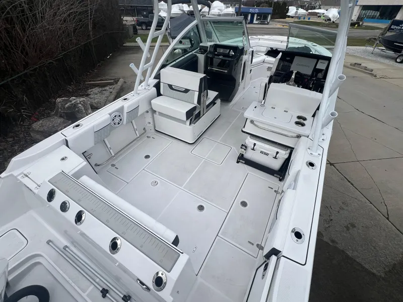 Slide: The Image of 2024 Blackfin 252 DC boat interior with spacious deck and seating. - 4