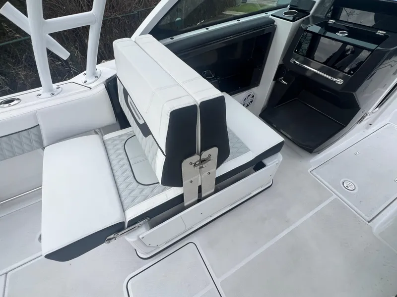Slide: The Image of 2024 Blackfin 252 DC boat interior with white seating and modern dashboard. - 8