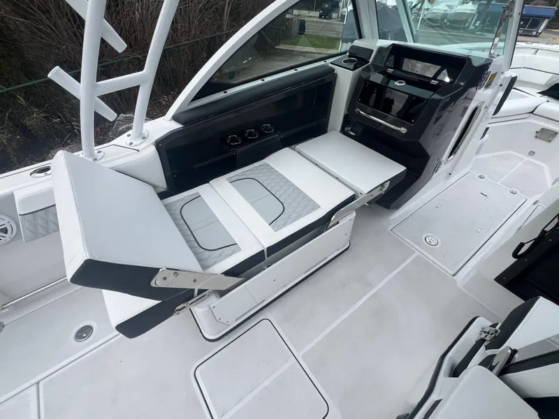 Slide: The Image of 2024 Blackfin 252 DC boat interior with adjustable seating and modern dashboard. - 9