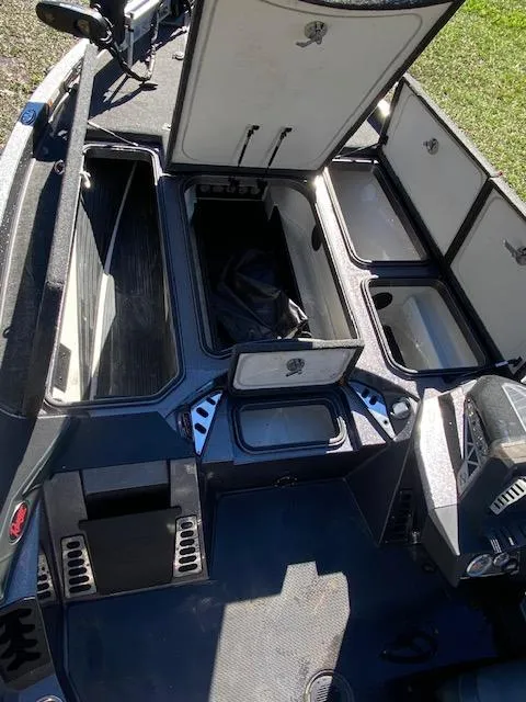 Slide: The Image of 2019 Ranger Z520L boat storage compartments open, showcasing spacious interior design. - 35