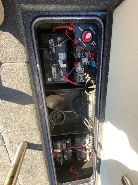 Slide: The Image of 2019 Ranger Z520L boat battery compartment with wiring and components. - 37